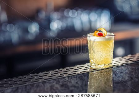 Cocktail Drink Whiskey Sour At Barcounter In Night Club Or Restaurant.