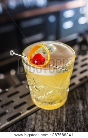 Cocktail Drink Whiskey Sour At Barcounter In Night Club Or Restaurant.