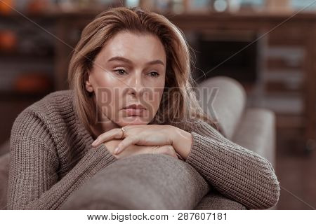 Appealing Businesswoman Feeling Thoughtful And Very Concerned