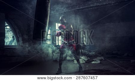 Hands Of Boxer Over Dark Gym Background. Strength, Attack And Motion Concept. Fit African American M