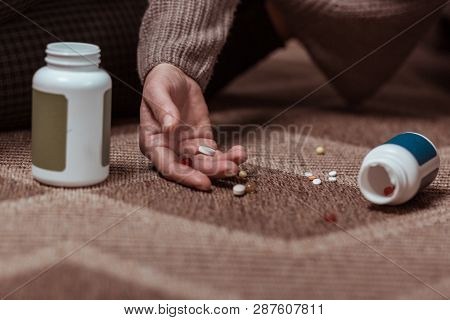 Close Up Of Woman Committing Suicide With Taking Meds