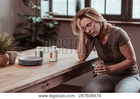 Stressed Woman Sweating And Feeling Awful After Panic Attack