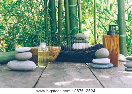 Spa Background With Woman's Hands And Clear Water On An Old Wooden Table. Japanese Style. Simplicity