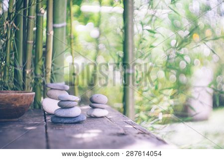 Spa Background With Woman's Hands And Clear Water On An Old Wooden Table. Japanese Style. Simplicity