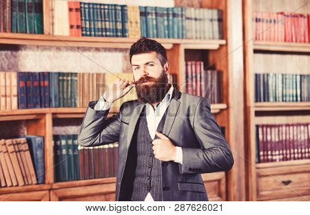 Senior Man With Long Beard Standing In A Vintage Librar