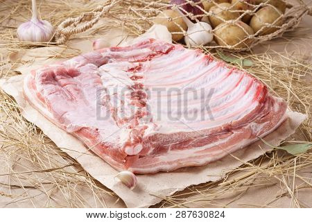 Raw Pork Meat - Spare Ribs Or Belly. Fresh Meat And Ingredients. Rustic Style.