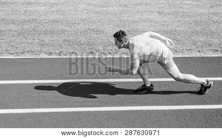Boost Speed Concept. Man Athlete Runner Push Off Starting Position Stadium Path Sunny Day. Runner Sp