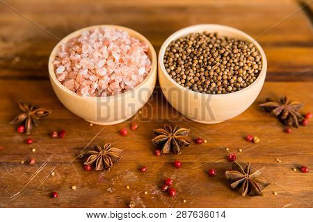 Himalayan Salt And Coriander Seeds In Bowls