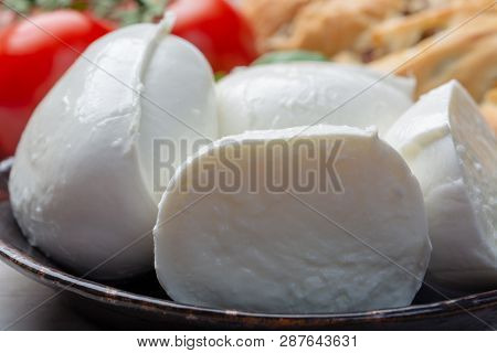 Balls And Pieces Of Buffalo Mozzarella, Soft Italian Scheese Made From The Milk Of Italian Mediterra