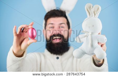 All Life Comes From An Egg. Celebration Of Spring Time Holiday. Hipster With Long Rabbit Ears Holdin