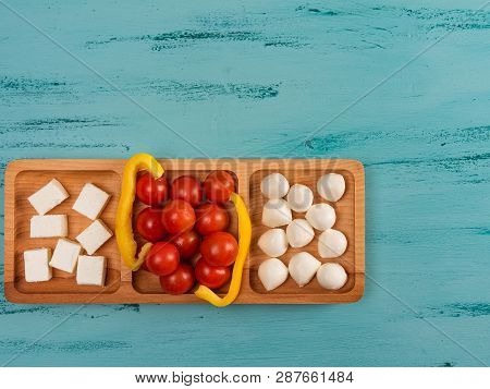 Cheese Compartmental Dish With Different Cheeses, On Rustic Wooden Background.
