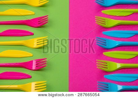Many Color Plastic Cutlers On A Bright Background