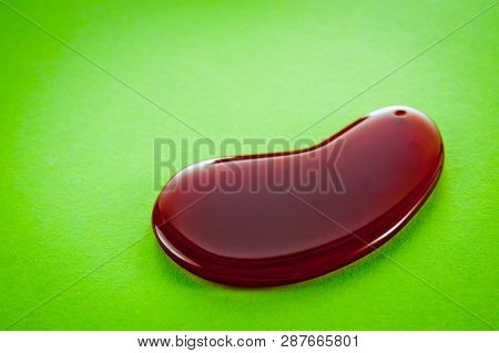 Guasha Scrapers For Body Massage According To The Ancient Method Shot On A Bright Green Background