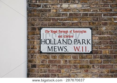 London, Uk - February 23, 2019: Holland Park Mews Street Name Sign On A Wall In The Royal Borough Of