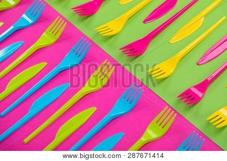 Many Color Plastic Cutlers On A Bright Background