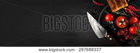 Tomato Soup With Chili And Vegetables. Healthy Food. On A Black Wooden Background. Banner Top View. 