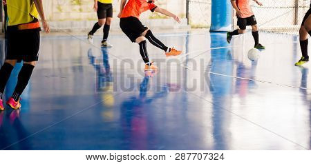 Futsal Player  Trap And Control The Ball For Shoot To Goal. Soccer Players Fighting Each Other By Ki
