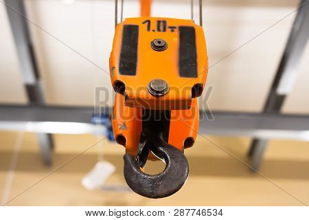 Hook Of Crane Working At Warehouse. Cathead Hook. Cargo Crane In The Industrial Workshop