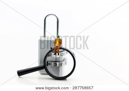 Miniature People Are Decrypting Unlock Padlock, Decrypt The Key. Concept For Data Security Breach, R