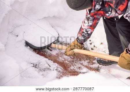 Clean The Snow With A Shovel. The Man Shovels Snow Shovels. Snow Shovel In Hand. Cleaning The Area I
