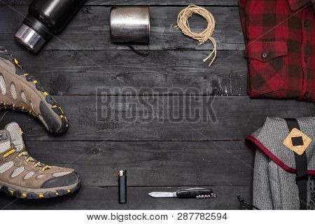 Preparing For A Hiking Trip: Backpacking Things And Clothes Flat Lay. Top View Of Trekking Boots, To