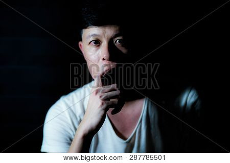 Portrait Of Asian Thoughtful Man Looking At The Camera And Thinking Of Something Carefully With Isol