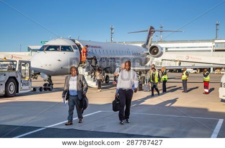 Johannesburg, South Africa, 28th February - 2019: Passengers Alighting From A Plane On The Tarmac.