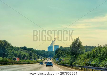 Unna, Germany - August 2, 2017: Traffic On The A2 Motorway And Scholven Coal Power Station, Germany,