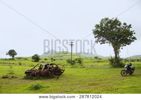 Adandoned Rusted Car In The Field, Maharashtra, India