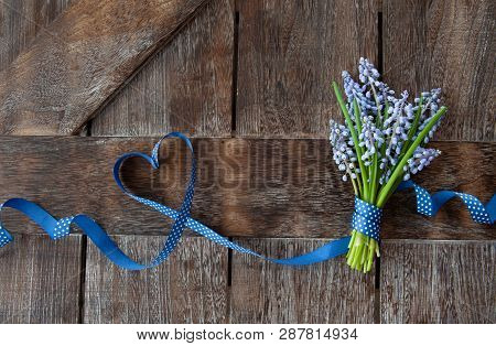 Bunch Of Blue Hyazinths On A Rustic Wooden Background