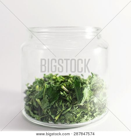 Dry Melissa And Mint Tea In The Jar Isolated On White Background. Homemade And Healthy
