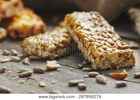 Sweets Bar Of Sunflower Seeds On A Vintage Background With Burlap. Delicious Oriental Sweets Gozinak