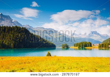 Exotic alpine lake Champfer in beautiful summer day. Location place Silvaplana village, Swiss alps, district Maloja, Europe. Scenic image of popular tourist destination. Discover the beauty of earth.