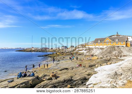Beach Time For Inuit People Enjoying The Sunny May Day At The Sea Fjord, Nuuk City, Greenland