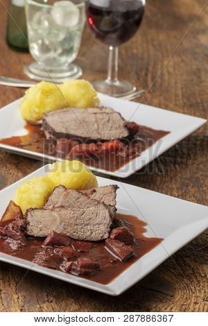 Bavarian Roasted Beef With Dumplings On Wood