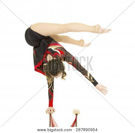 Flexible Equilibrist Performs Exercises On Acrobatic Walking Sticks.