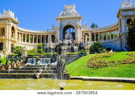 Marseille. Palais De Longchamp With Fountains And Sculptures In Sunny Day, View From The Right Side.