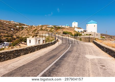 Traditional Greek Windmills On The Way To The Village Of Kastro On The Island Of Sifnos In Greece.