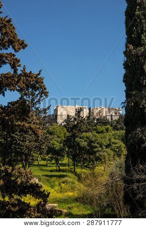 Acrolis Of Athens Greece And Parthenon On Blue Sky Background, Sunny Day. View From Dionisiou Areopa