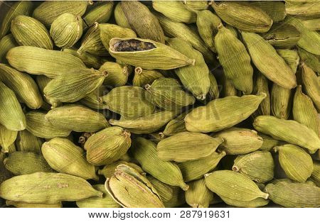 Cardamon Seeds Background. Natural Seasoning Texture. Natural Spices And Food Ingredients.