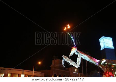 2/25/2019 Las Vegas, Nevada: Fire Breathing Music Playing Dancing Praying Mantis Sculpture on Freemont Street in Las Vegas Nevada. 

