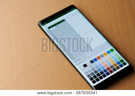 New York, Usa - March 6, 2019: Microsoft Excel Menu On Smartphone Screen Laying On Wooden Desk