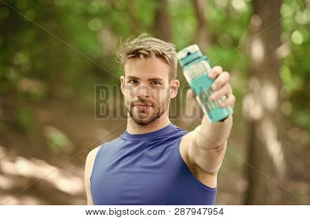 Towards A Healthier Lifestyle. Athlete Drink Water After Training In Park. Man Athletic Appearance H