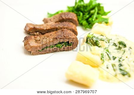 Beef Saltimbocca With Sage And Ham Close-up On A Plate.