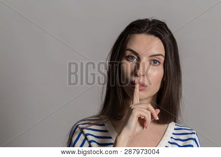 A Pretty Woman With Fluffy Hair, Dressed Casually. Studio Shot Of A Lovely Beautiful Woman Isolated 