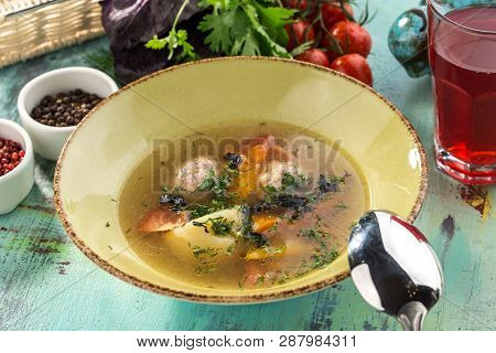 Soup With Meat Balls And Vegetables On Blue Wooden Table