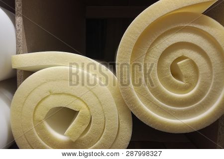 Rolls White And Yellow Foam Rubber Building Material Texture.