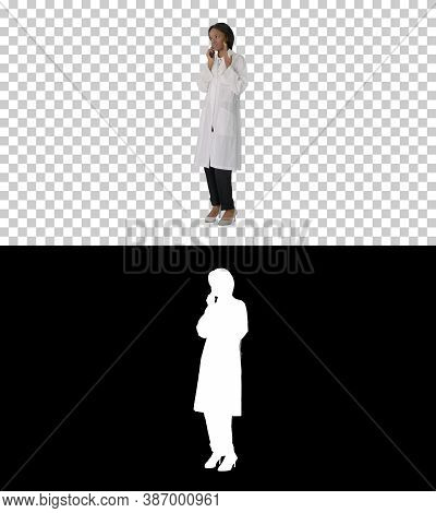 African American Female Doctor Talking On The Phone, Alpha Chann