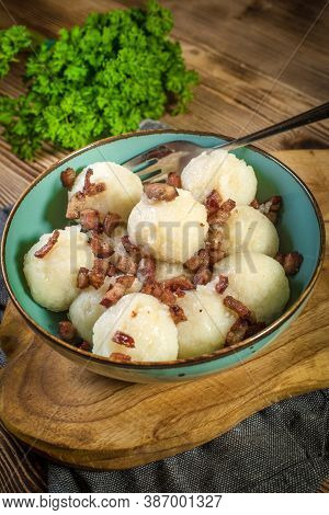 Meat Stuffed Potato Dumplings With Fried Onion And Greaves.