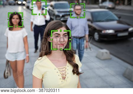 Facial Recognition System Identifying People On City Street